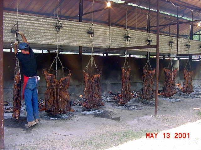 Roasting pigs at Mansura, the Cochon de Lait Festival